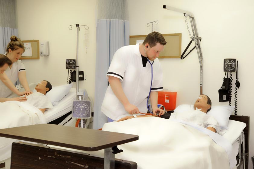 Maria College albany NY photo of nurses learning how to take blood pressure