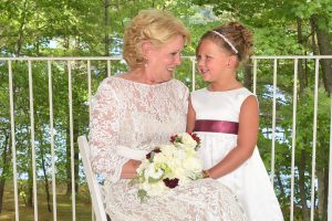 a quiet moment with the flower girl and bride at an albany ny wedding