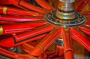 Spokes of a vintage red fire engine