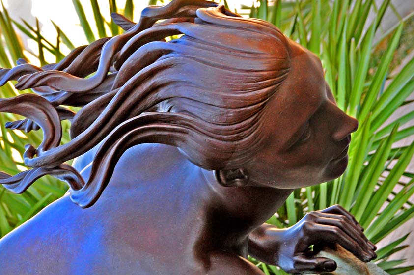 bronze statue of a woman at brookgreen gardens myrtle beach